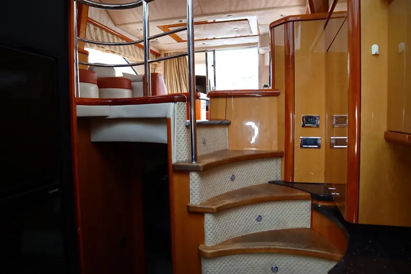 Slide: The Image of Interior of a 2005 Sunseeker Manhattan 50 yacht with wooden stairs and modern design. - 9