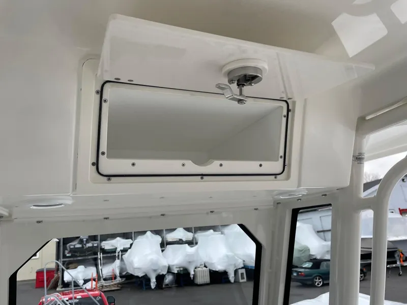 Slide: The Image of 2024 Pursuit S 248 Sport boat interior storage compartment. - 21