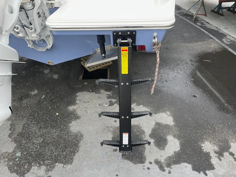 Slide: The Image of 2024 Pursuit S 248 Sport boat with a mounted ladder. - 23