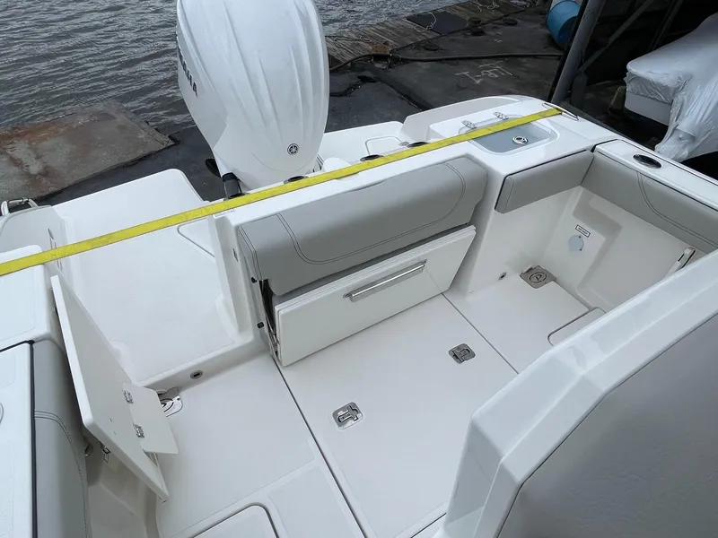Slide: The Image of 2024 Pursuit S 248 Sport boat interior with seating and storage compartments. - 6