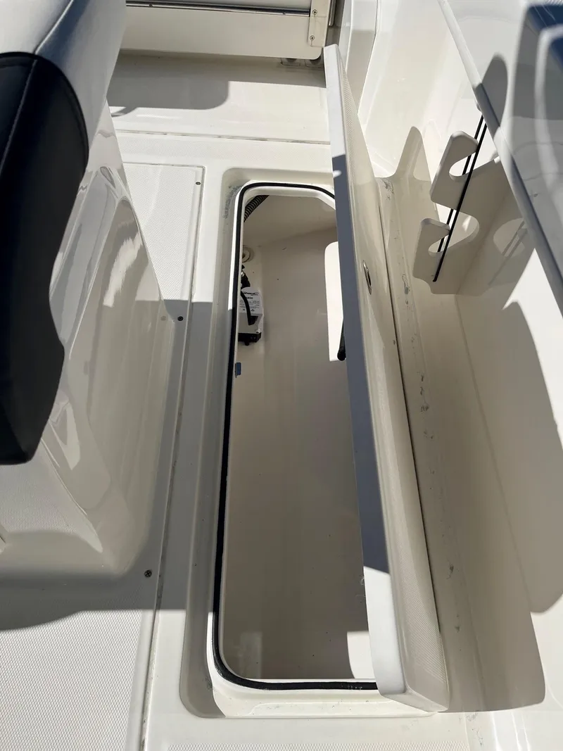 Slide: The Image of 2023 Bayliner Trophy T24 boat storage compartment, open and spacious. - 15