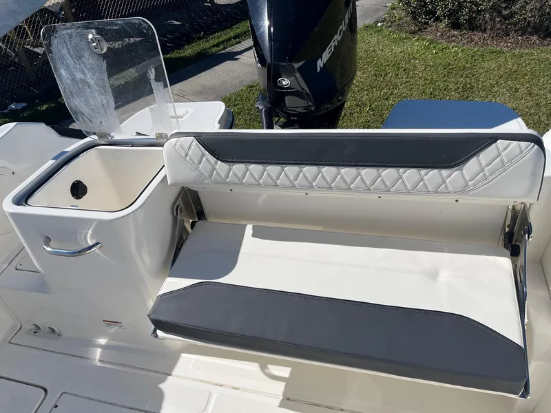 Slide: The Image of 2023 Bayliner Trophy T24 boat interior with seating and storage. - 3