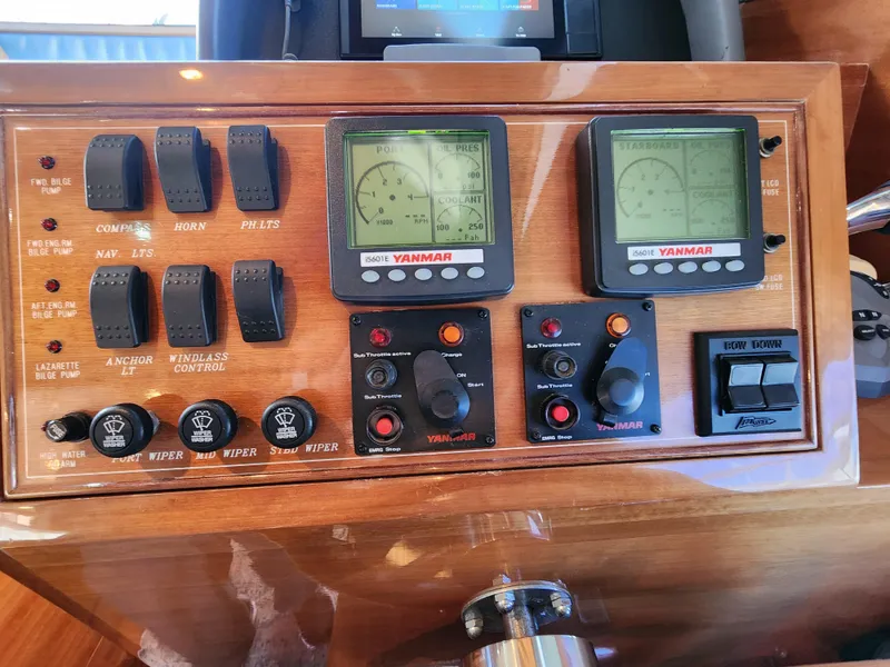 Slide: The Image of Control panel of a 2007 Ocean Alexander Veloce yacht with Yanmar displays and switches. - 13