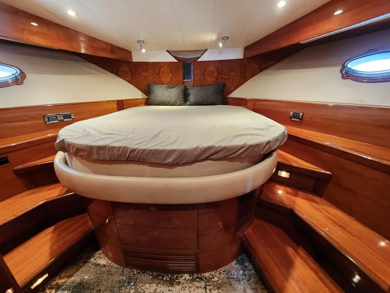 Slide: The Image of Luxurious 2007 Ocean Alexander Veloce yacht bedroom with elegant wood finish and cozy lighting. - 17