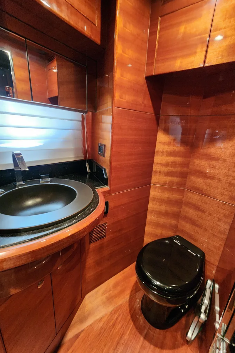 Slide: The Image of Luxurious 2007 Ocean Alexander Veloce yacht bathroom with wood paneling and modern fixtures. - 19