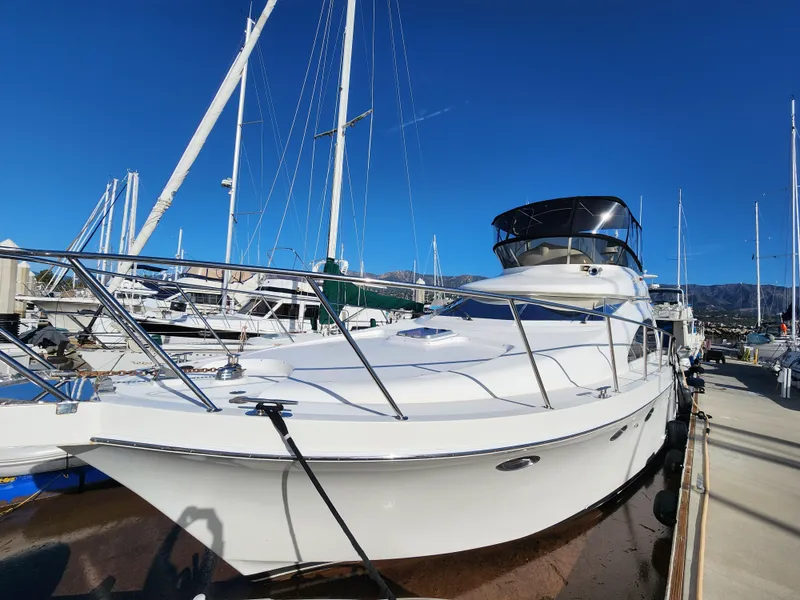 Slide: The Image of 2007 Ocean Alexander Veloce yacht docked at marina under clear blue sky. - 2