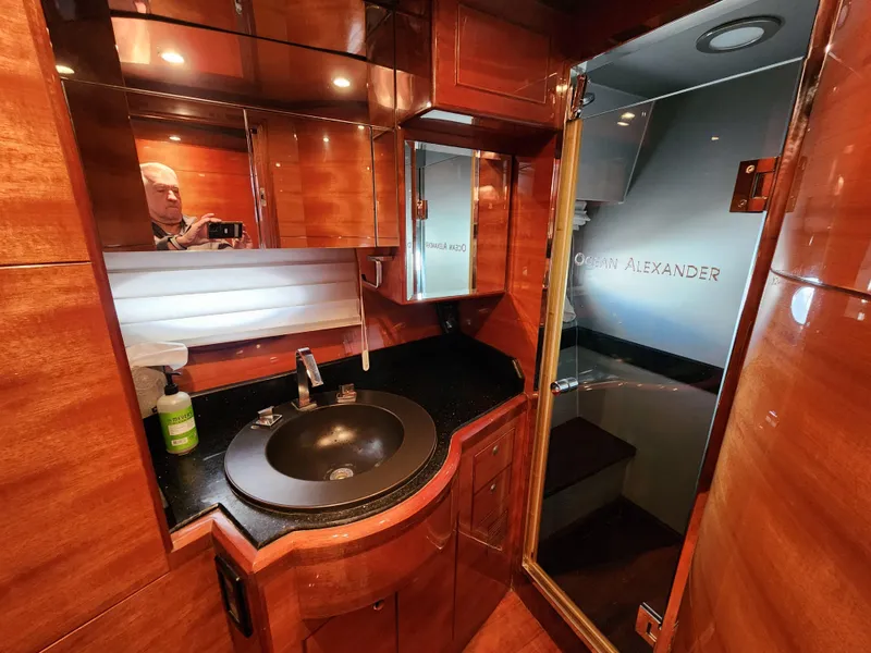 Slide: The Image of Luxurious 2007 Ocean Alexander Veloce yacht bathroom with wood finish and modern fixtures. - 20