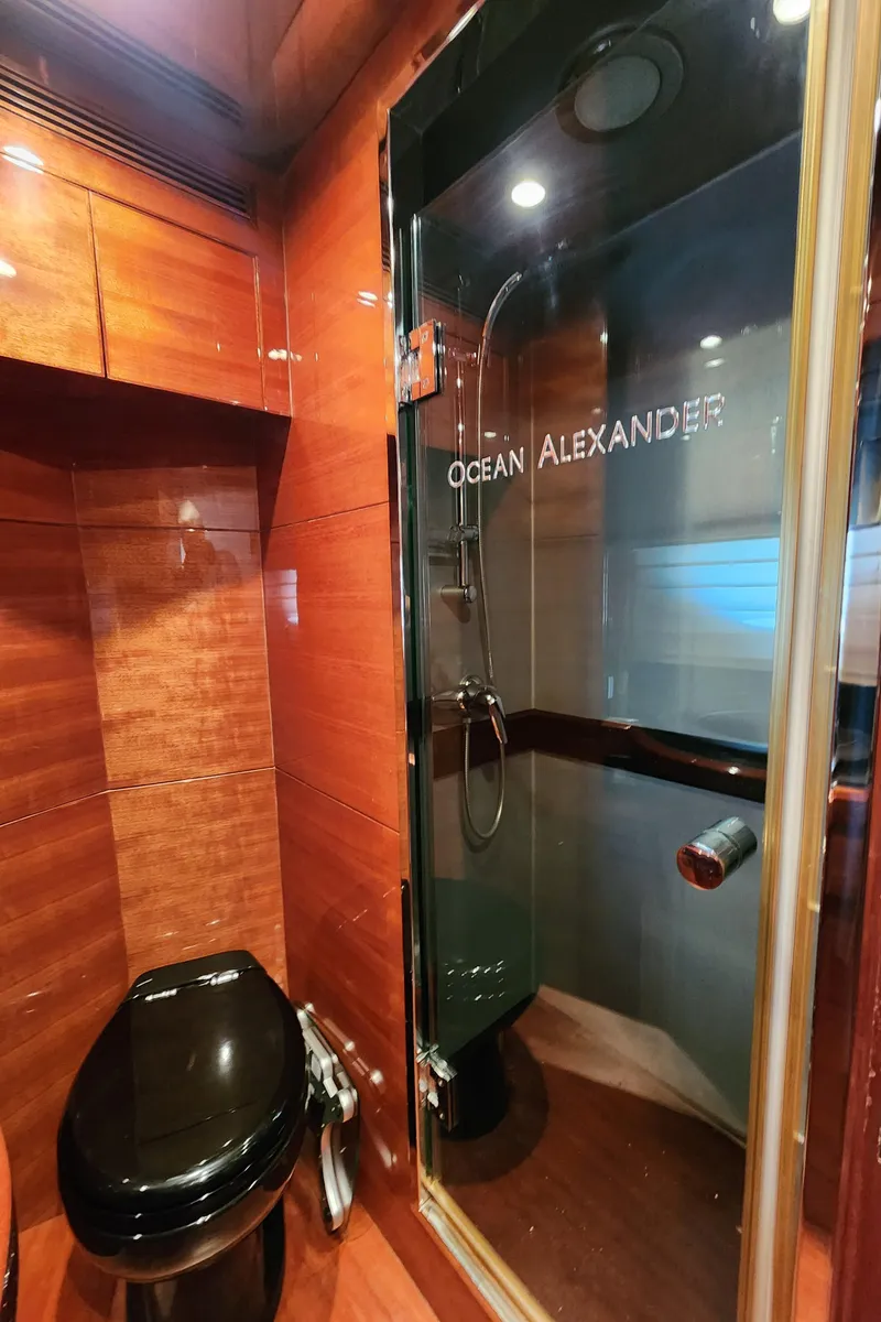 Slide: The Image of Luxurious bathroom in 2007 Ocean Alexander Veloce yacht with sleek wood finish and modern fixtures. - 22