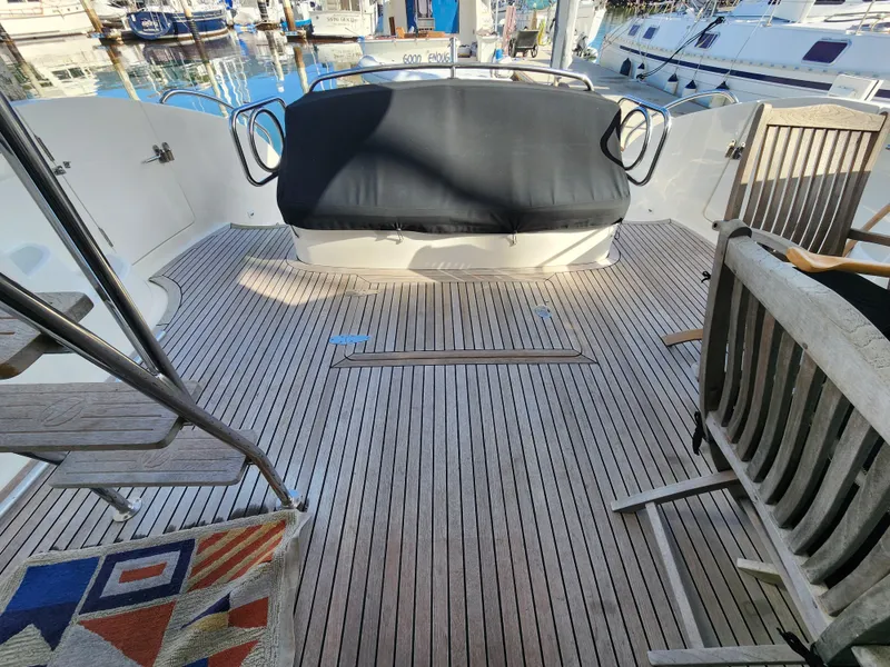 Slide: The Image of 2007 Ocean Alexander Veloce yacht deck with wooden flooring and seating area. - 26