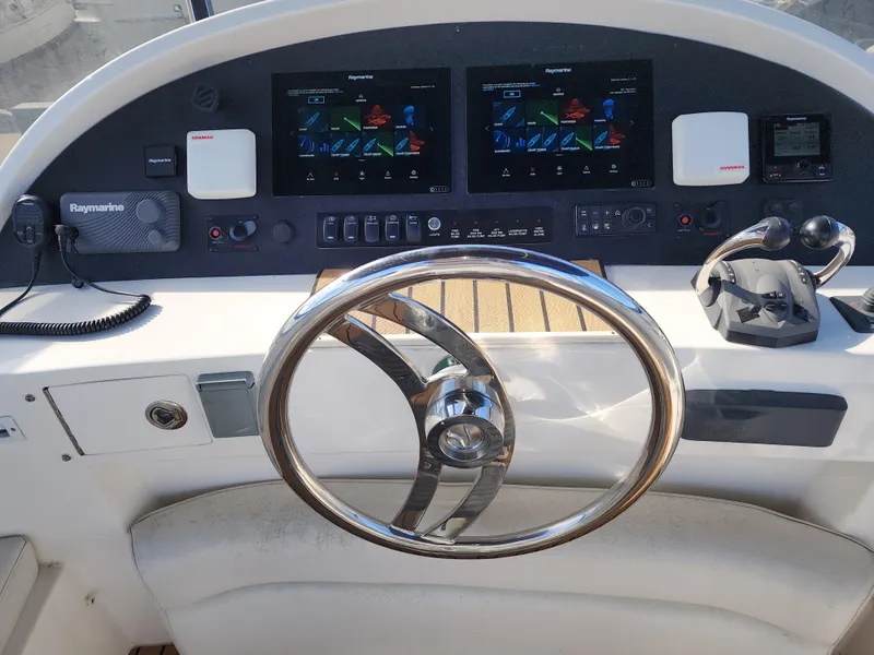Slide: The Image of 2007 Ocean Alexander Veloce yacht helm with dual displays and modern controls. - 31