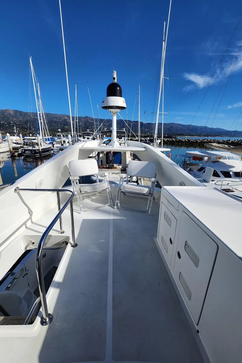 Slide: The Image of 2007 Ocean Alexander Veloce yacht deck with seating, docked in a marina under clear blue skies. - 33