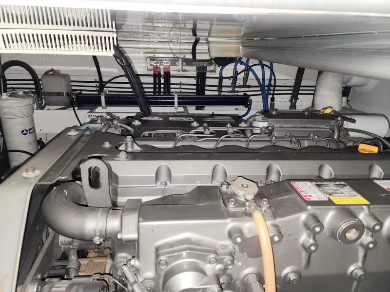 Slide: The Image of Engine room of 2007 Ocean Alexander Veloce yacht, showcasing mechanical components and wiring. - 36