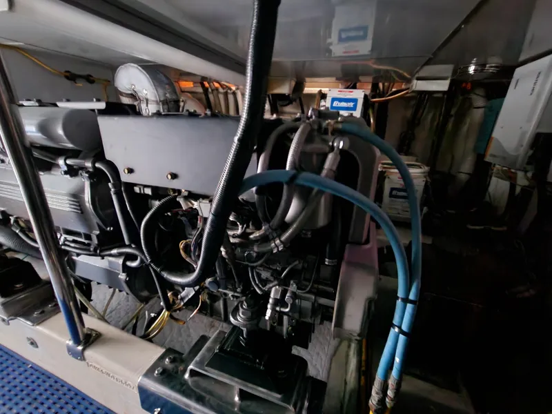 Slide: The Image of Engine room of 2007 Ocean Alexander Veloce yacht, showcasing complex machinery and wiring. - 38