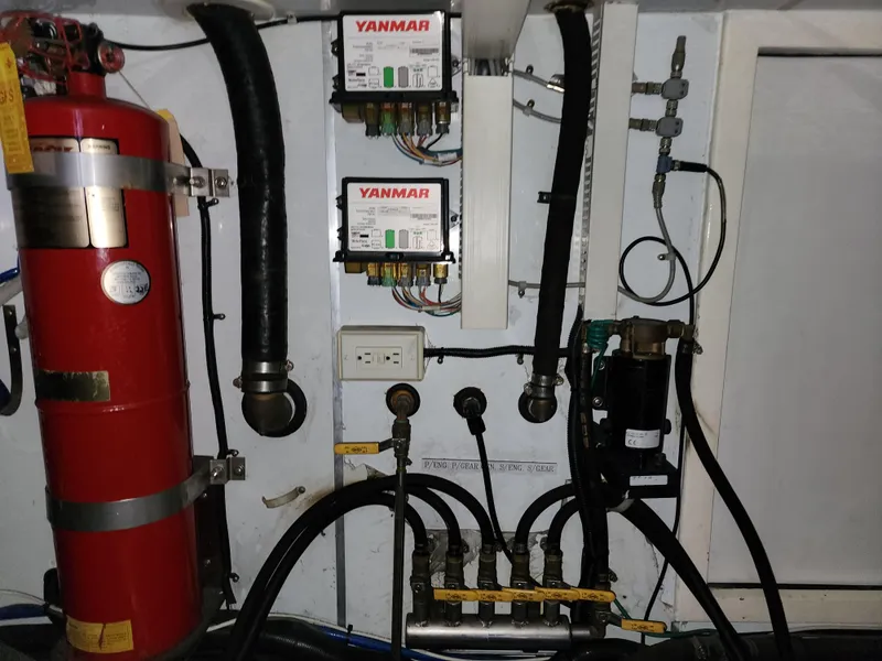 Slide: The Image of Engine room of 2007 Ocean Alexander Veloce yacht with Yanmar components and fire extinguisher. - 39