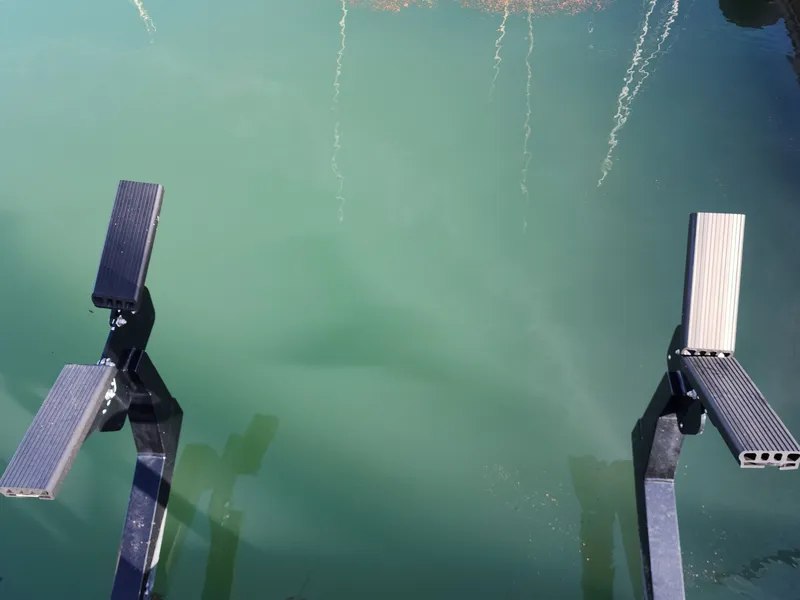 Slide: The Image of Boat lift supports over green water, Ocean Alexander Veloce 2007. - 44