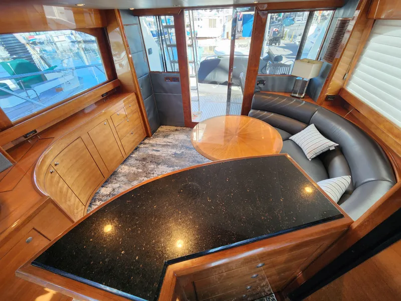 Slide: The Image of Luxurious 2007 Ocean Alexander Veloce yacht interior with elegant wood finishes and modern seating. - 6