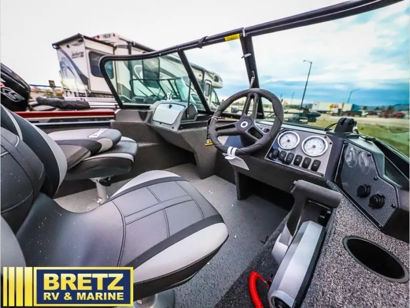 Slide: The Image of 2024 Angler 1650 Sport boat interior with steering wheel and dashboard at Bretz RV & Marine. - 6