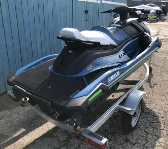 Slide: The Image of 2024 Yamaha WaveRunner VX Cruiser on trailer, blue and black design. - 3