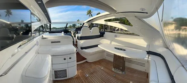 Slide: The Image of Luxurious 2006 Princess 58v yacht interior with white seating and wooden flooring. - 11