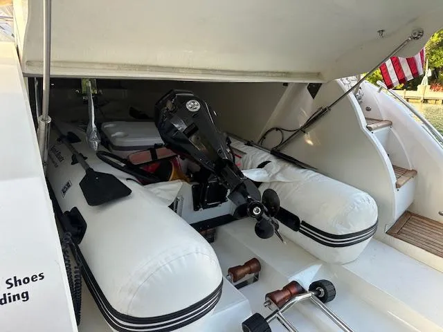 Slide: The Image of 2006 Princess 58v yacht with inflatable dinghy and outboard motor in storage compartment. - 16