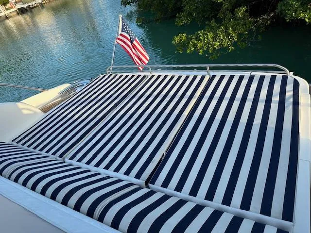 Slide: The Image of Striped sunbathing deck on 2006 Princess 58v yacht with American flag. - 20
