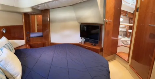 Slide: The Image of Luxurious cabin interior of 2006 Princess 58v yacht with TV and bedding. - 27