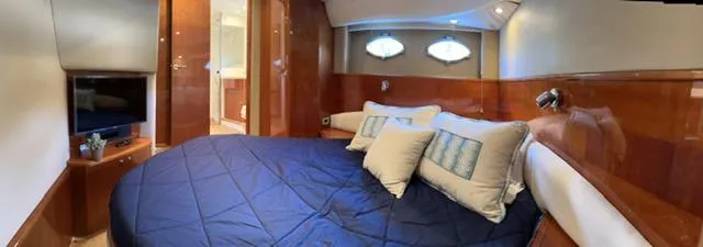 Slide: The Image of Luxurious cabin interior of 2006 Princess 58v yacht with cozy bedding and modern amenities. - 28