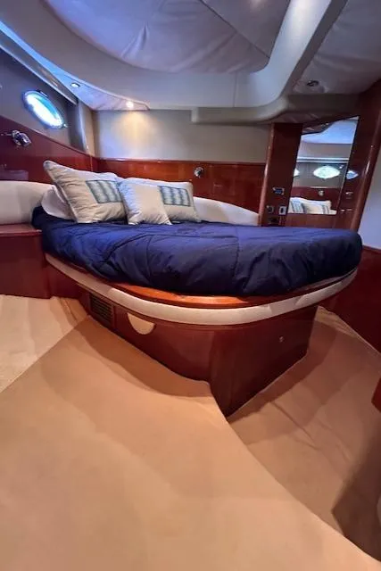 Slide: The Image of Luxurious cabin interior of 2006 Princess 58v yacht with plush bedding. - 30