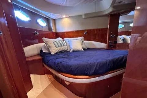 Slide: The Image of Luxurious cabin interior of 2006 Princess 58v yacht with plush bedding. - 31
