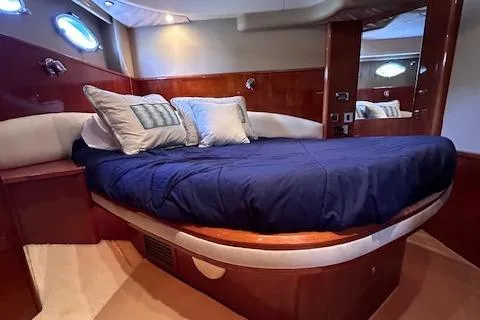 Slide: The Image of Luxurious cabin interior of 2006 Princess 58v yacht with elegant bedding. - 32