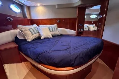 Slide: The Image of Luxurious cabin interior of 2006 Princess 58v yacht with cozy bedding. - 33