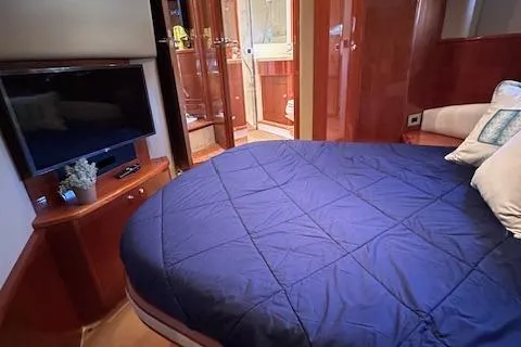 Slide: The Image of Luxurious bedroom interior of 2006 Princess 58v yacht with TV and ensuite bathroom. - 34