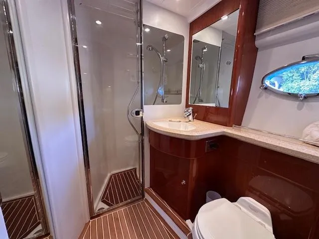Slide: The Image of Luxurious bathroom in 2006 Princess 58v yacht with shower, sink, and toilet. - 35