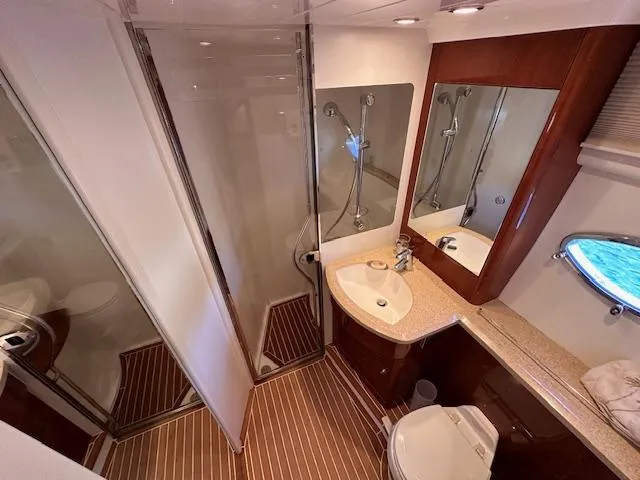 Slide: The Image of Luxurious bathroom in 2006 Princess 58v yacht with shower, sink, and toilet. - 37
