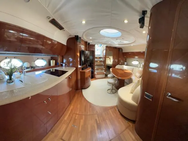 Slide: The Image of Luxurious 2006 Princess 58v yacht interior with elegant wood finishes and modern amenities. - 43
