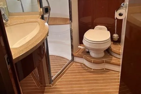 Slide: The Image of Luxurious 2006 Princess 58v yacht bathroom with wood flooring and modern fixtures. - 44