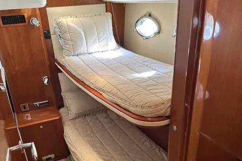 Slide: The Image of Interior cabin of 2006 Princess 58v yacht with twin beds and wooden finish. - 46