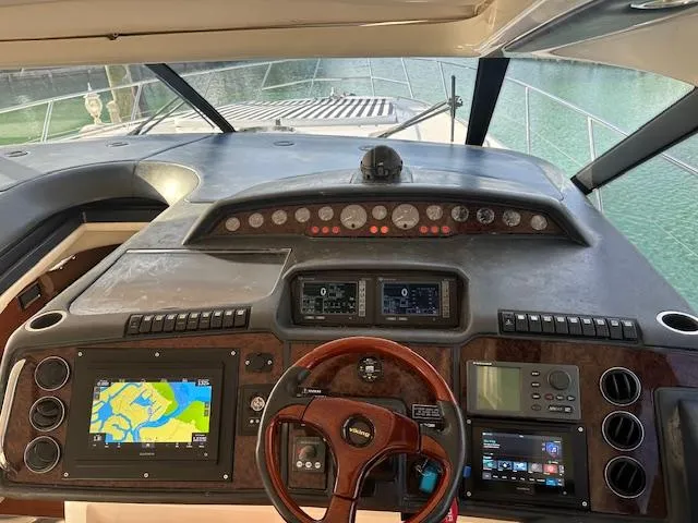 Slide: The Image of Cockpit of 2006 Princess 58v yacht with navigation and control panels. - 6