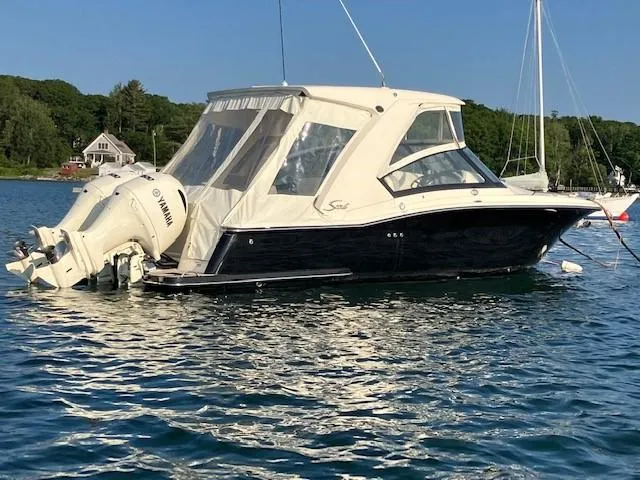 The Image of 2022 Scout 277 Dorado boat with Yamaha outboard, anchored on a sunny day. - 0