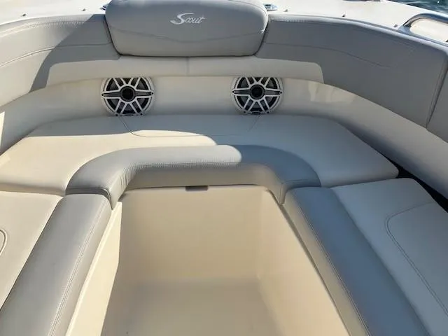 Slide: The Image of 2022 Scout 277 Dorado boat interior with cushioned seating and built-in speakers. - 7