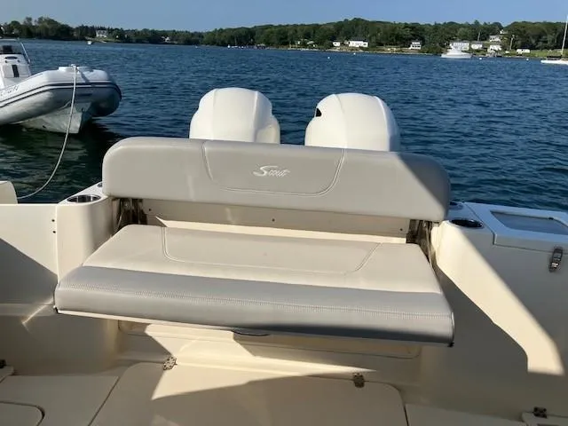 Slide: The Image of 2022 Scout 277 Dorado boat with seating, on a calm lake. - 9