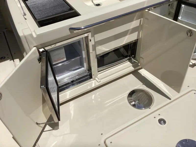 Slide: The Image of 2016 Chris-Craft 34 Catalina boat interior with open storage compartments. - 16