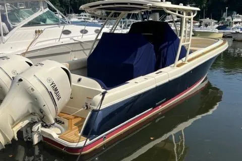 Slide: The Image of 2016 Chris-Craft 34 Catalina boat with Yamaha engines docked in marina. - 2