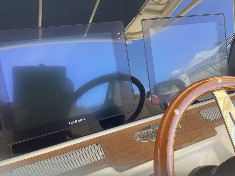 Slide: The Image of 2016 Chris-Craft 34 Catalina dashboard with Garmin navigation screens. - 22