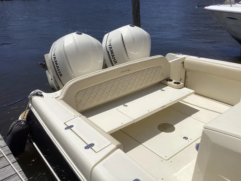 Slide: The Image of 2016 Chris-Craft 34 Catalina boat with twin Yamaha outboard engines docked. - 24