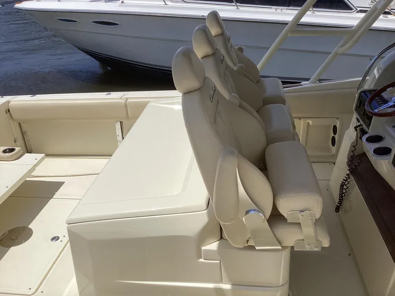 Slide: The Image of 2016 Chris-Craft 34 Catalina boat interior with cushioned seating. - 25