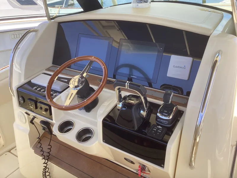 Slide: The Image of 2016 Chris-Craft 34 Catalina helm with modern controls and Garmin navigation system. - 26