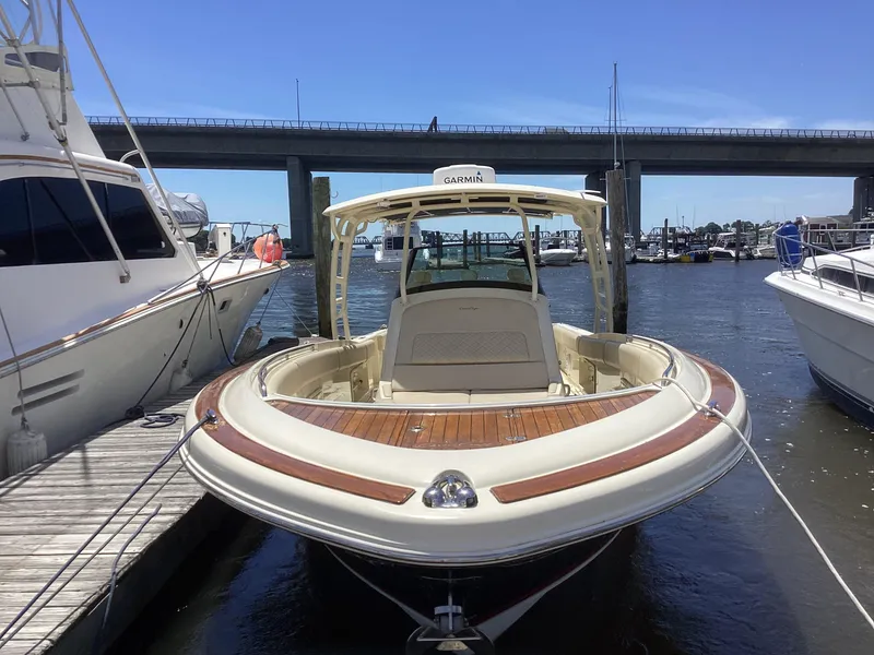 Slide: The Image of 2016 Chris-Craft 34 Catalina docked at a marina, front view. - 28