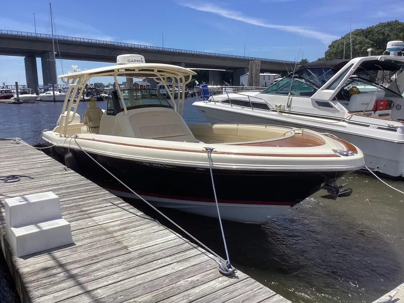 Slide: The Image of 2016 Chris-Craft 34 Catalina docked at a marina on a sunny day. - 29