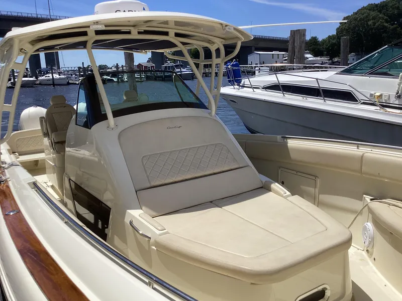 Slide: The Image of 2016 Chris-Craft 34 Catalina boat docked at a marina on a sunny day. - 30